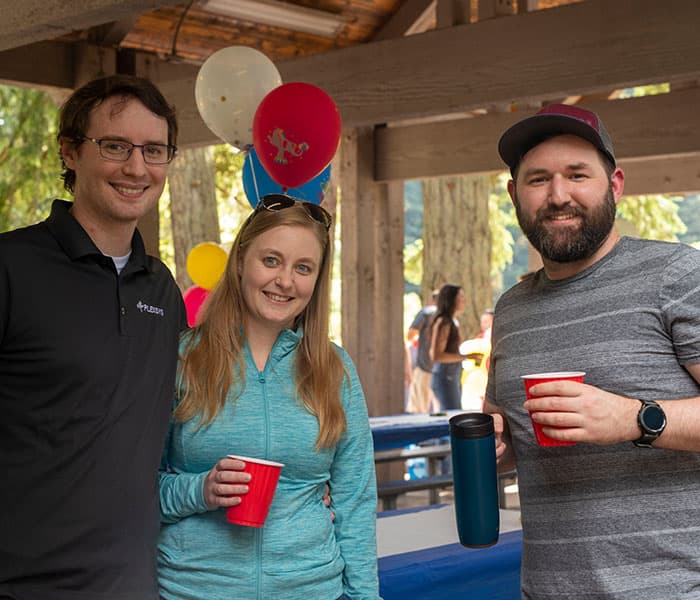 Employees hanging out at company picnic